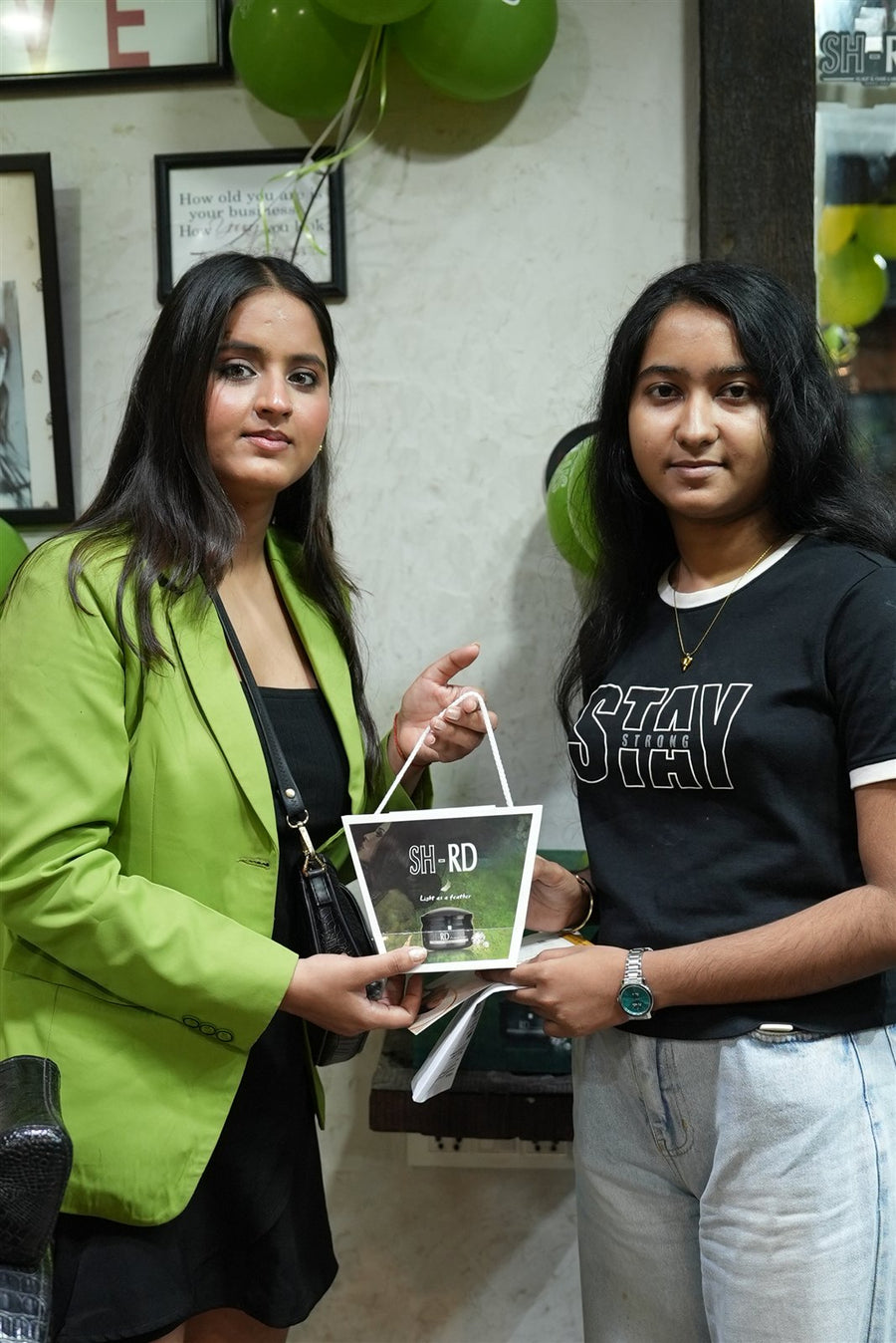 Guests posing with SH-RD gift bags at Avani Riverside Mall