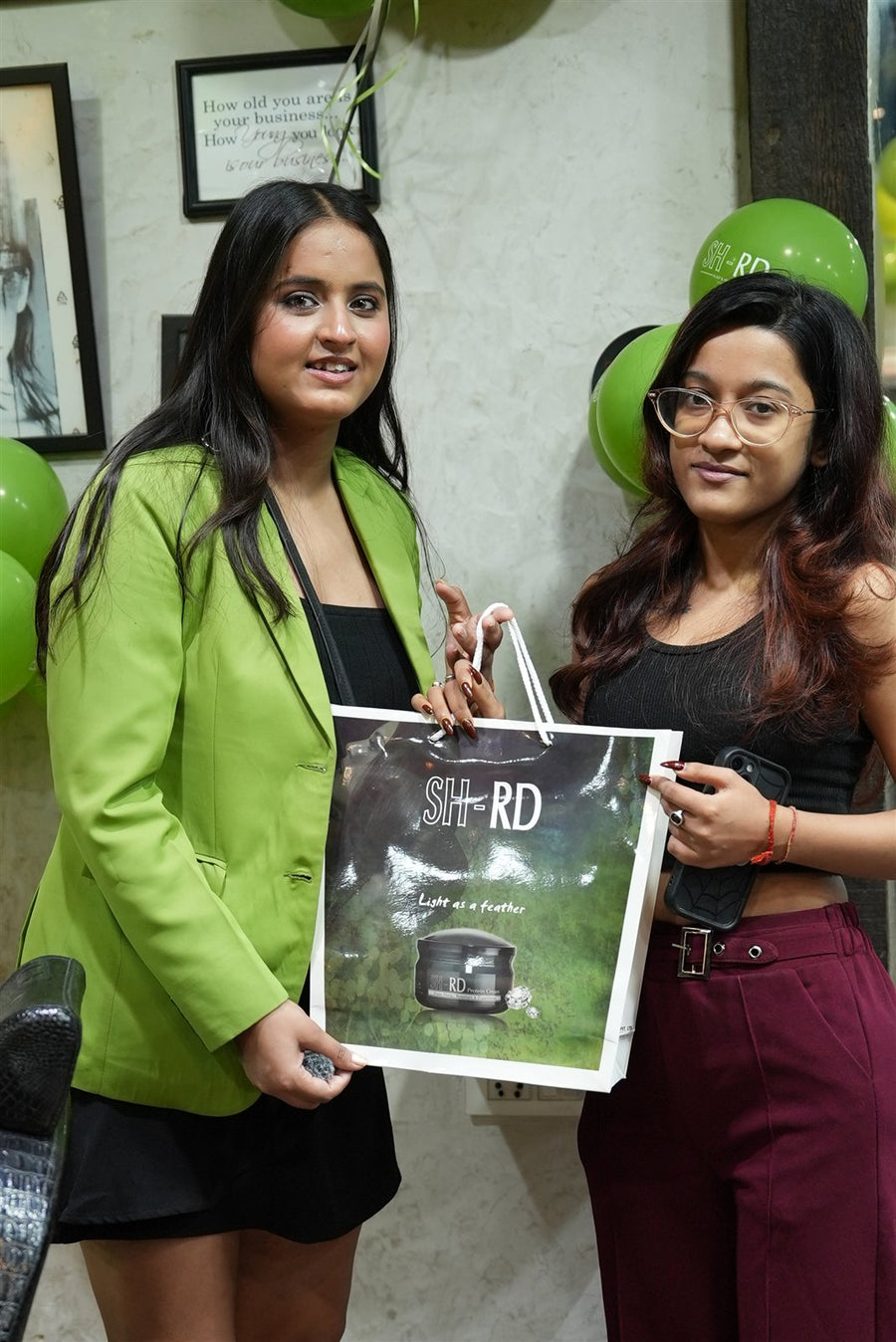 Two guests with an SH-RD gift bag at Avani Riverside Mall