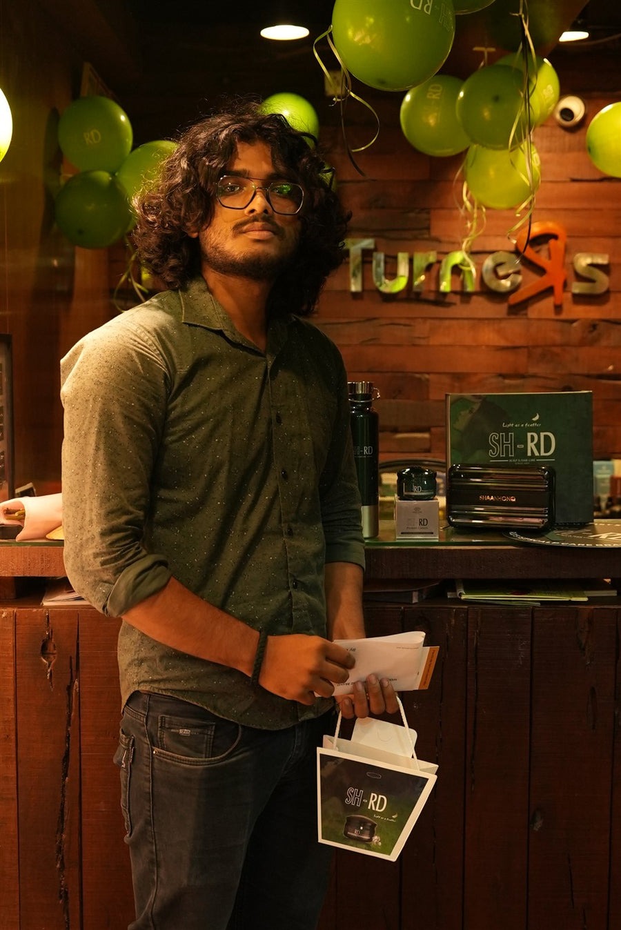 A guest with an SH-RD gift bag at the reception, Avani Riverside Mall