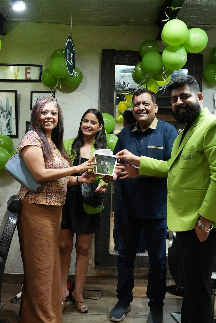 Team and guests posing with an SH-RD product at Avani Riverside Mall