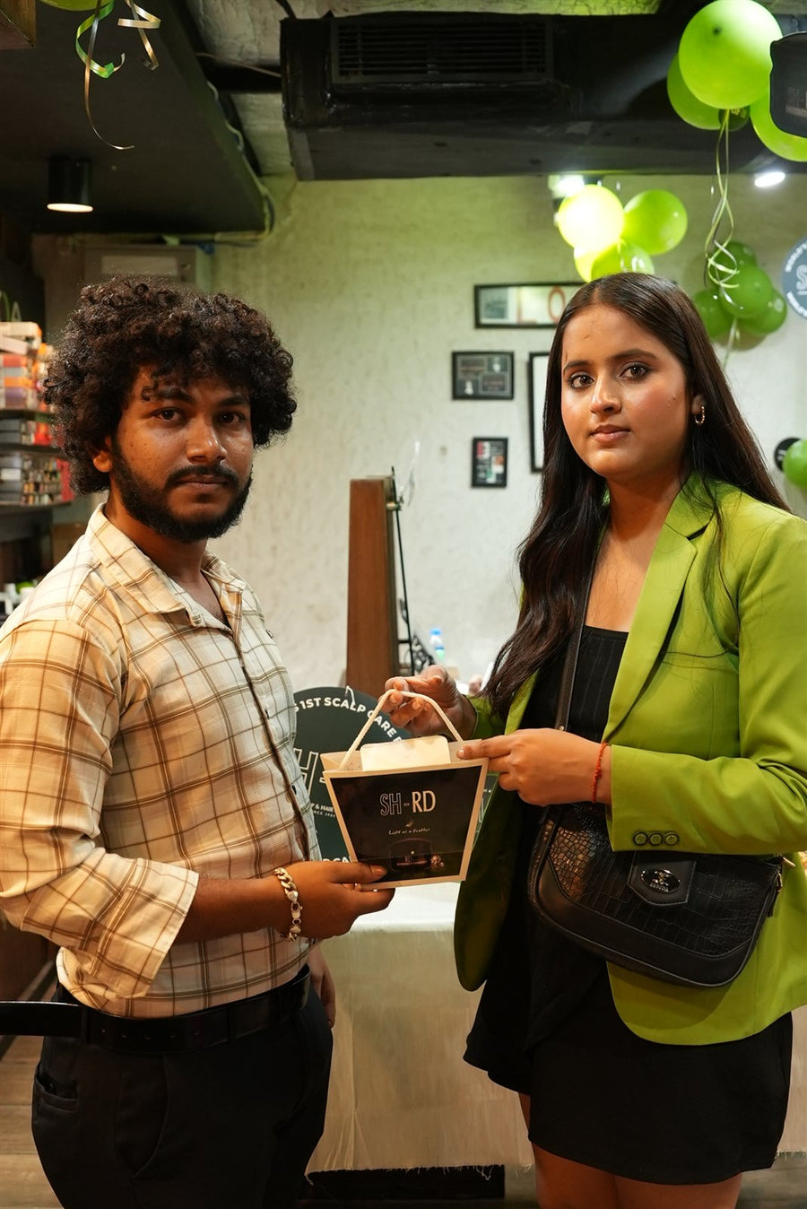Guest receiving an SH-RD gift box from a team member at Avani Riverside Mall