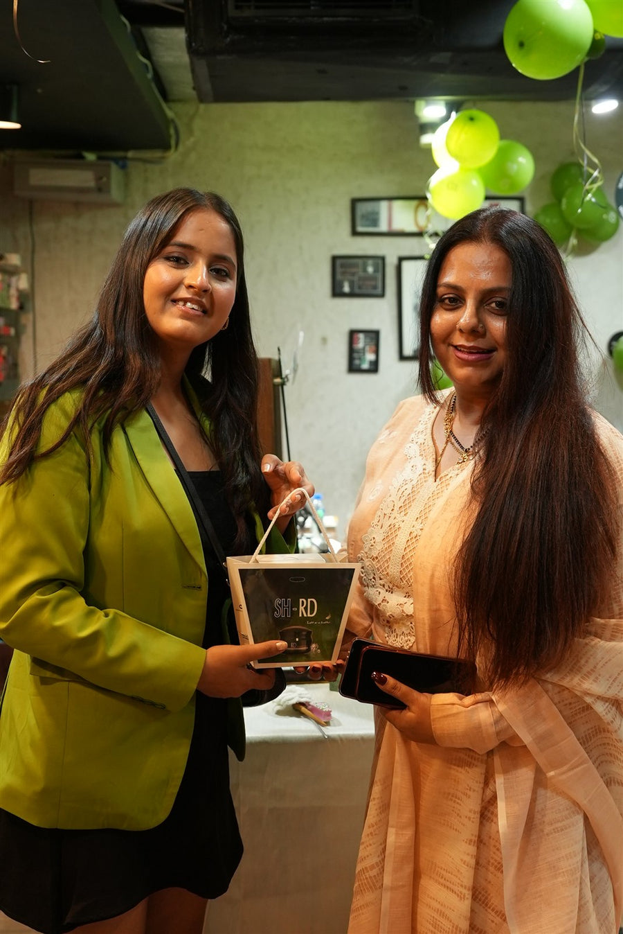 A guest receiving a keepsake from the team at Avani Riverside Mall
